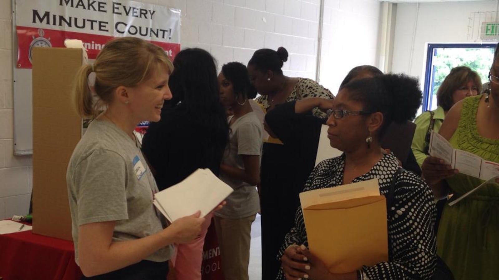 Teachers and employers network at a 2014 hiring fair in the Frayser community of Memphis. Shelby County Schools is hosting a jobs fair in June to assist displaced teachers.