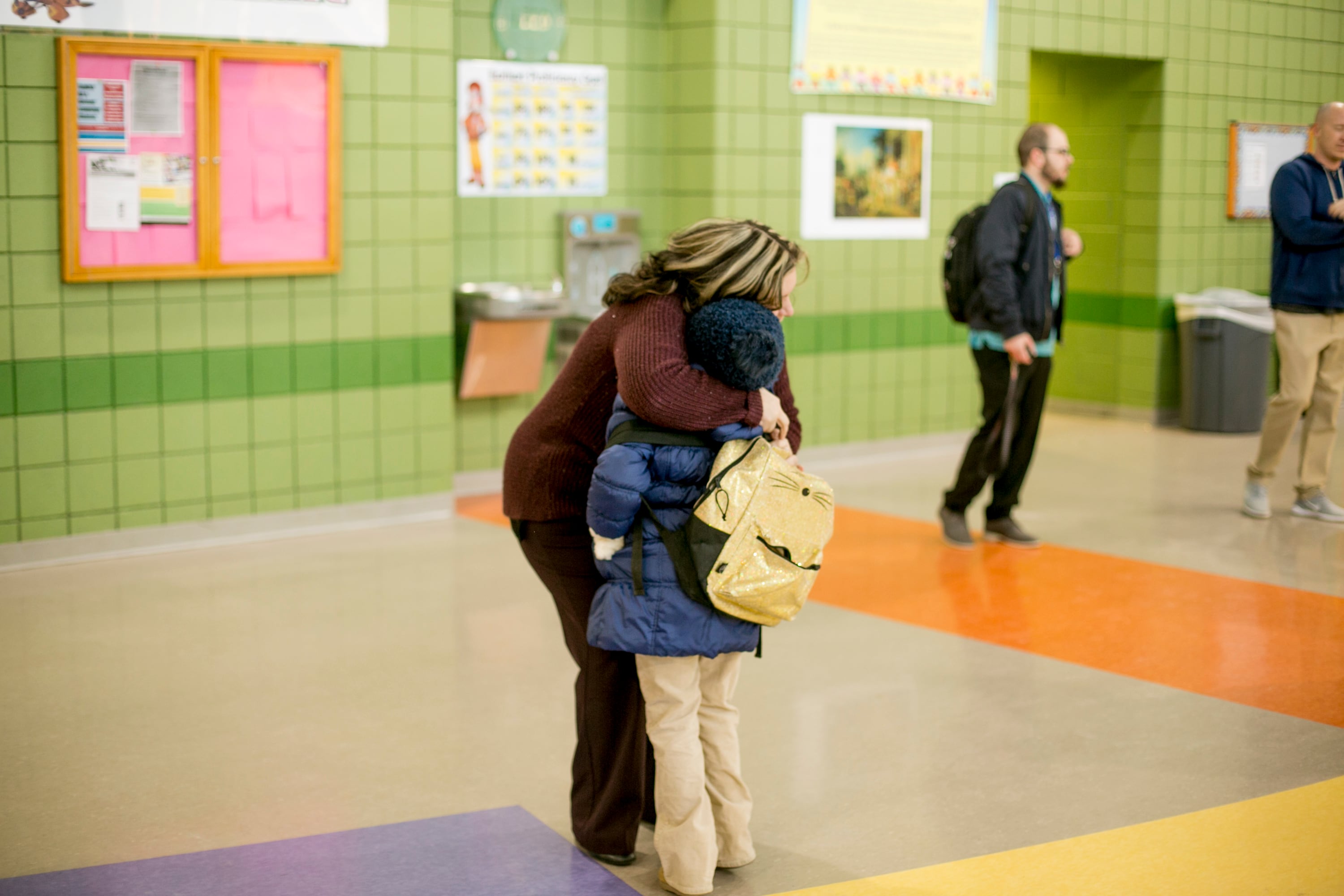 Principal Melissa Villarreal greets a student as he arrives for class at Earhart Elementary-Middle School in southwest Detroit.