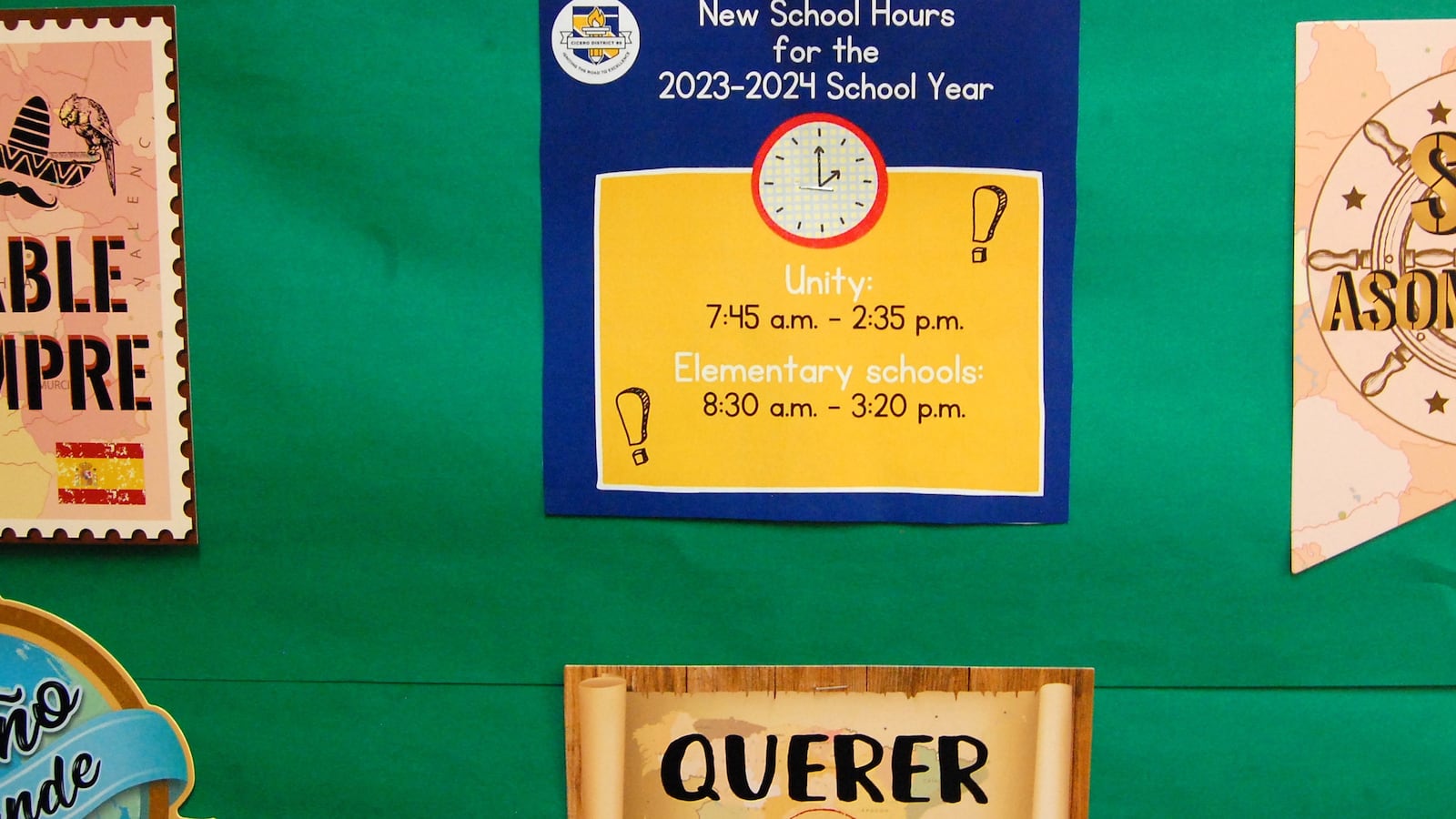 A sign on a green bulletin board indicates the new school hours for 2023.