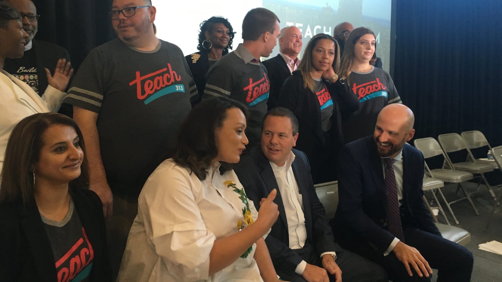 Tonya Allen, president of the Skillman Foundation, speaks with Tony Cervone, an executive at GM, and Jack Elsey, executive director of the Detroit Children's fund at an event held to announce a teacher recruitment initiative.