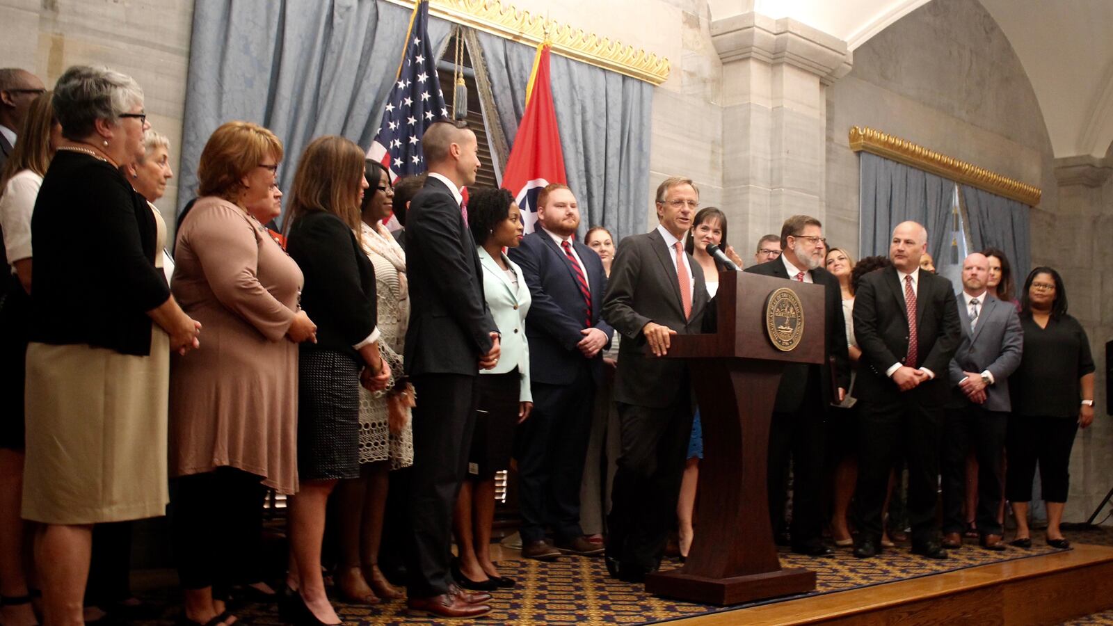 Flanked by 37 educators serving as Tennessee's new "TNReady ambassadors," Gov. Bill Haslam announces the kickoff of a statewide "listening tour" aimed at improving administration of the state's standardized assessment.