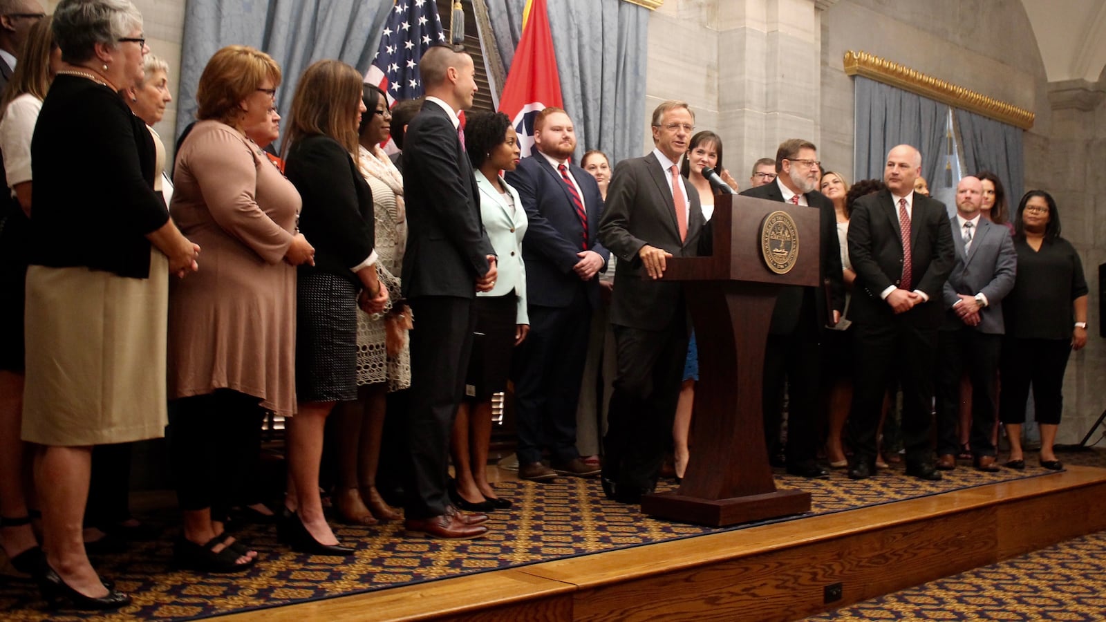 Flanked by 37 educators serving as Tennessee's new "TNReady ambassadors," Gov. Bill Haslam announces the kickoff of a statewide "listening tour" aimed at improving administration of the state's standardized assessment.