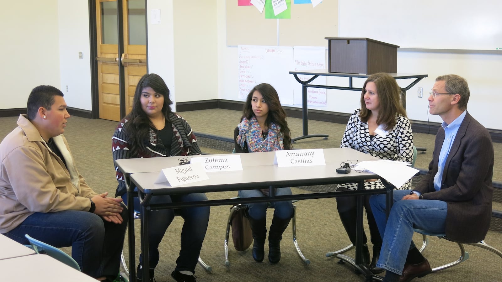 Denver schools superintendent Tom Boasberg and North High School Principal Nicole Veltze meet with three seniors—from left, Miguel Figueroa, Zulema Campos, and Amairany Casillas—to talk about graduating high school.