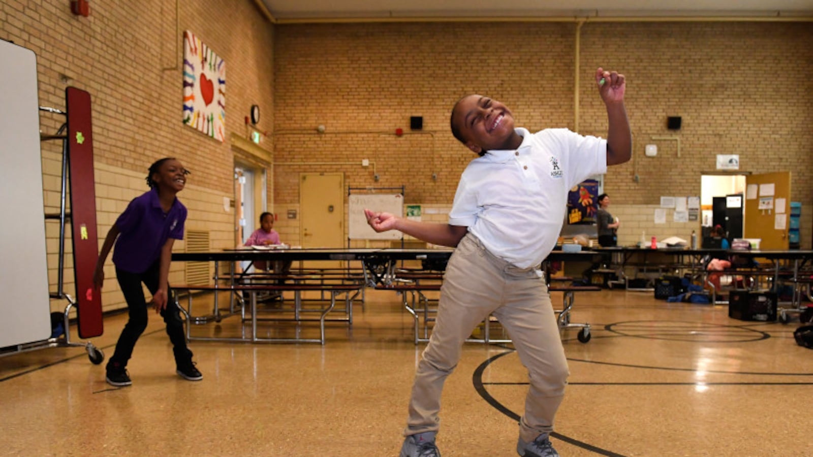 Hannah Moore, 8, shows off her moves during practice for an after school talent show that is part of the Scholars Unlimited After School program at Ashley Elementary school on March 10, 2017 in Denver, Colorado. Scholars Unlimited is an after school and summer program funded by the 21st Century Community Learning Center Grant, which is threatened to be cut entirely under the White House's budget cuts. The 21st Century Community Learning Center Grant served almost 20,000 students in Colorado betw