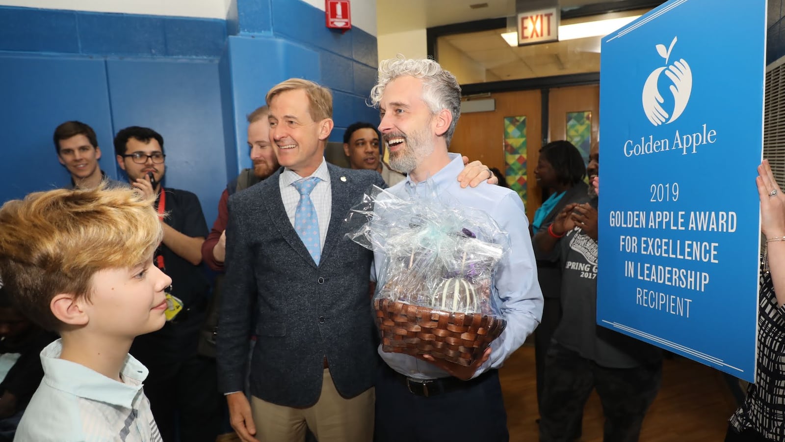 Golden Apple President Alan Mather, left, stands with Southside Occupational Academy Principal Joshua Long, who won a Golden Apple award April 3, 2019, for leadership.