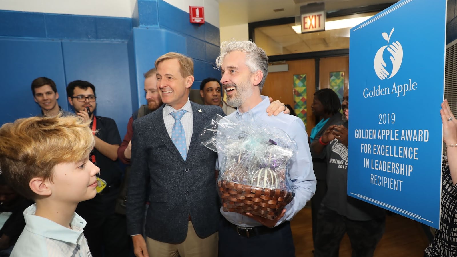 Golden Apple President Alan Mather, left, stands with Southside Occupational Academy Principal Joshua Long, who won a Golden Apple award April 3, 2019, for leadership.