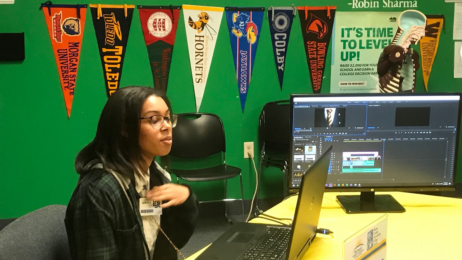 A student from Detroit School of Arts demonstrates using film editing software during a press conference about the Detroit district's efforts to increase career pathways and college dual enrollment courses.