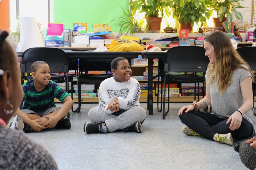 Homeless students participate in an afterschool reading club.