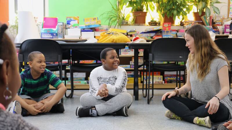 Homeless students participate in an afterschool reading club.