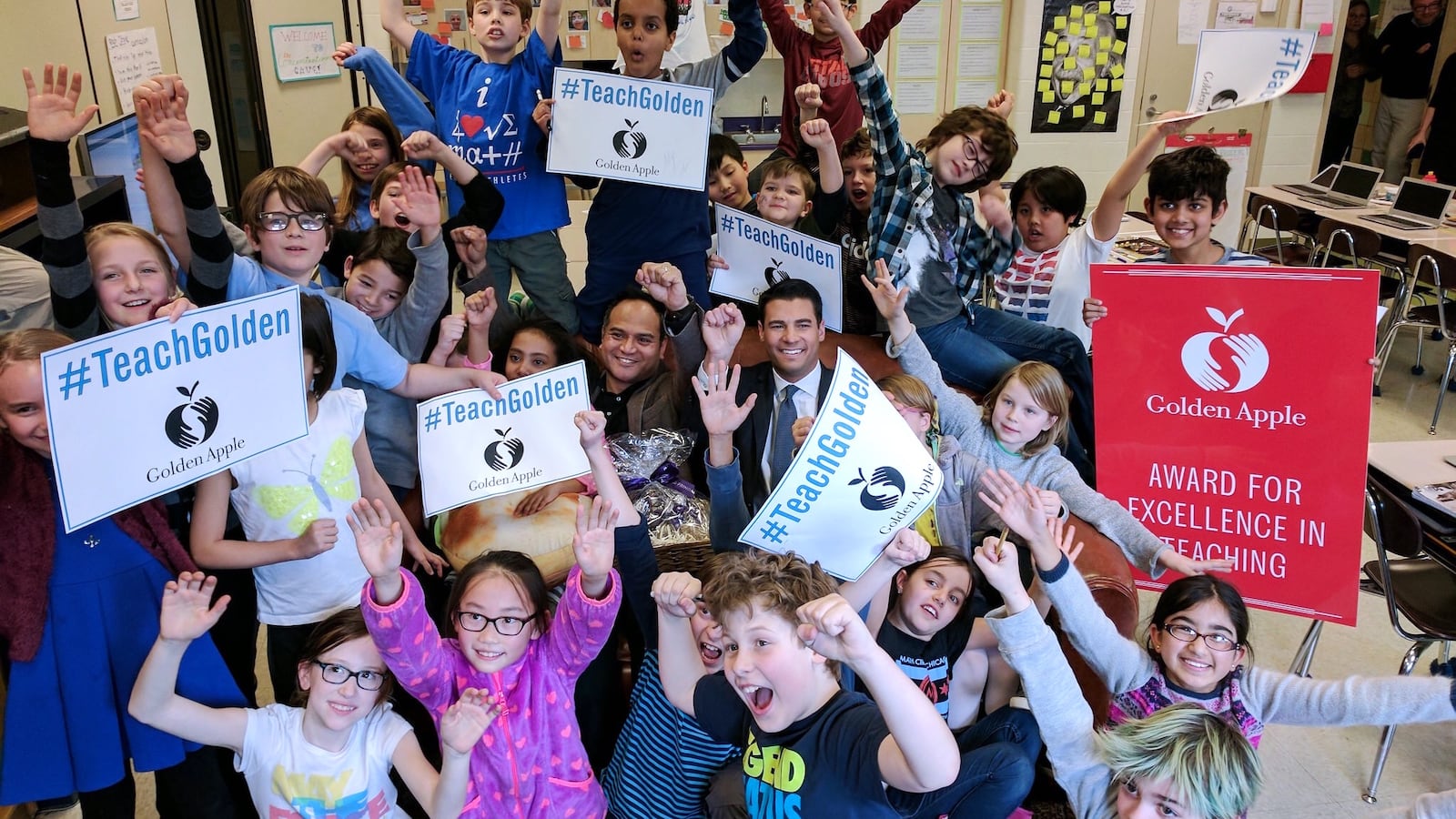 Fitzgerald Crame celebrates his 2017 Golden Apple Award with his students