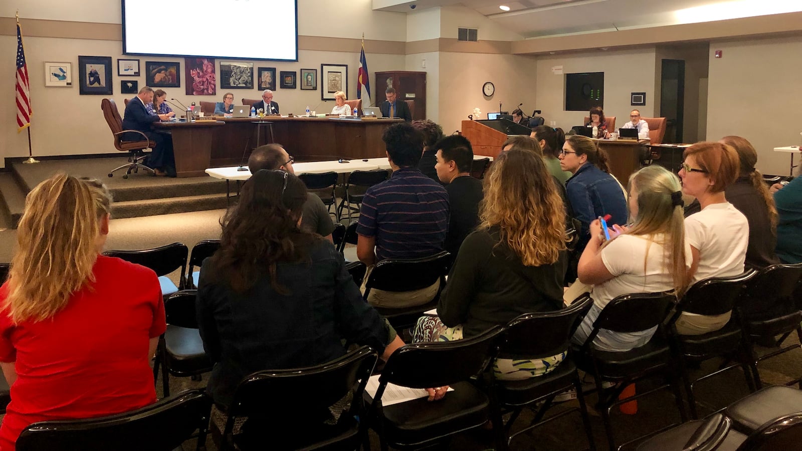 Some teachers, parents, and students wait to speak in favor of updating LGBTQ policies at the Jefferson County School Board meeting Thursday.