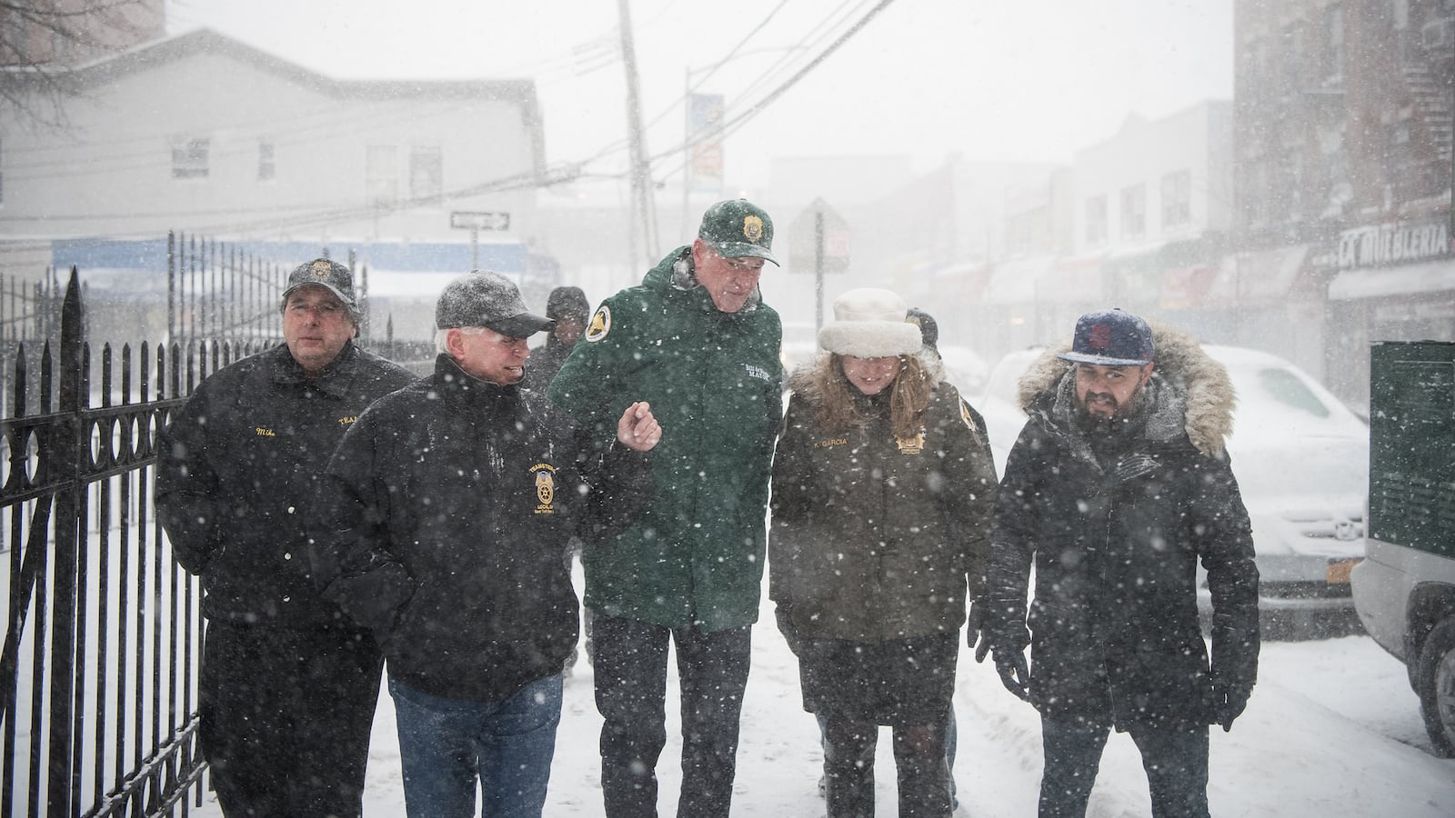 Mayor Bill de Blasio toured a snow-covered neighborhood in Queens with other city officials Thursday.