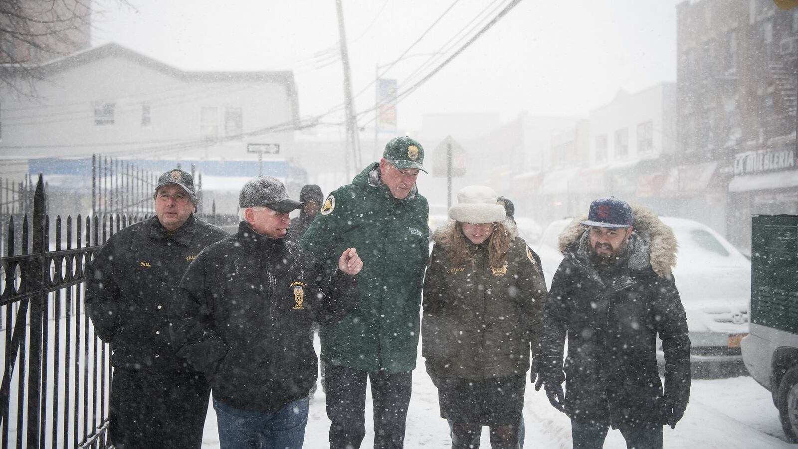 Mayor Bill de Blasio toured a snow-covered neighborhood in Queens with other city officials Thursday.