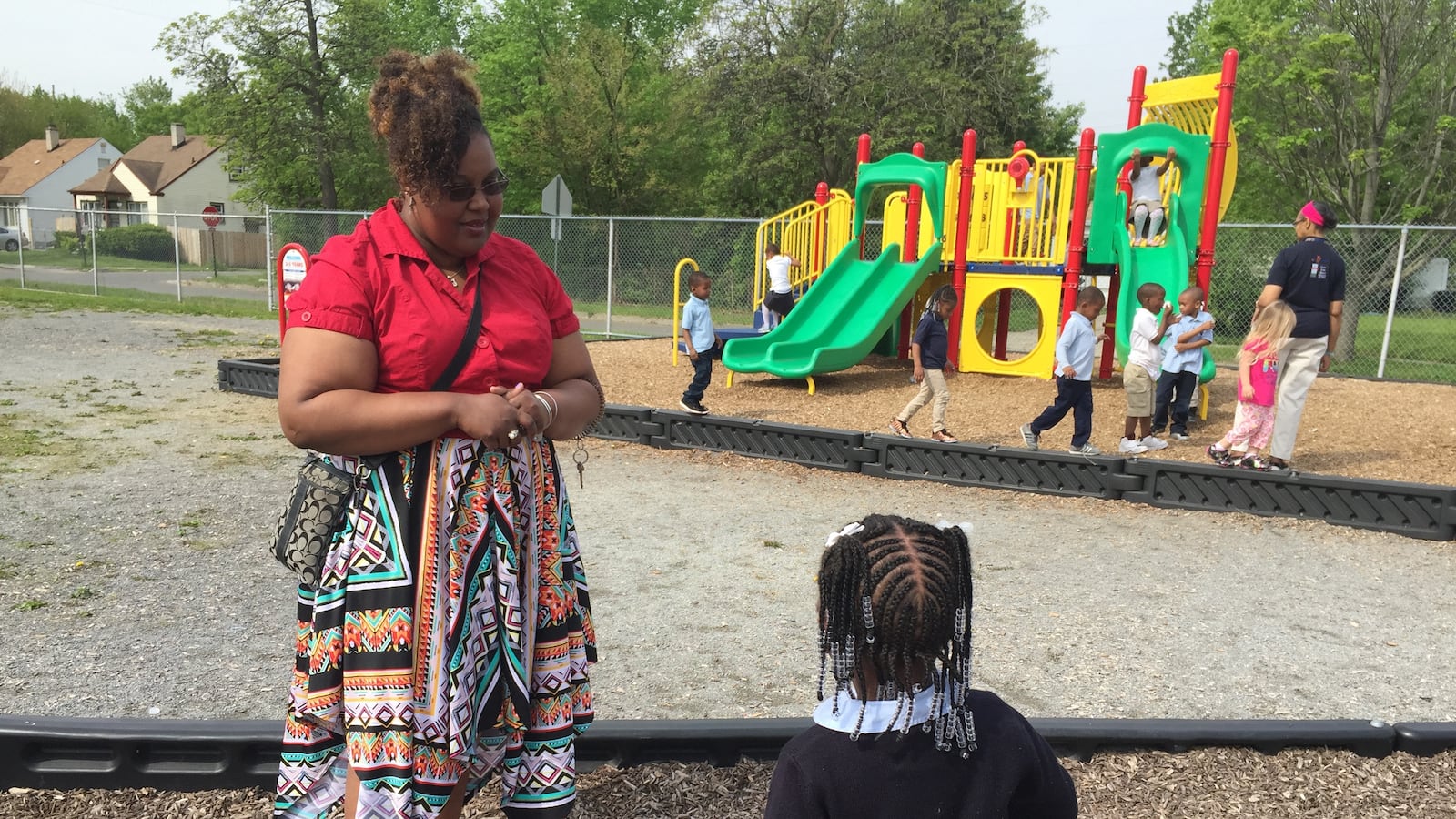 Detroit Pre-K teacher Candace Graham talks to a student on the playground at the Carver STEM Academy. She says her students get "left out a lot" because the school's two other preschool classrooms are in the PNC Grow Up Great program.