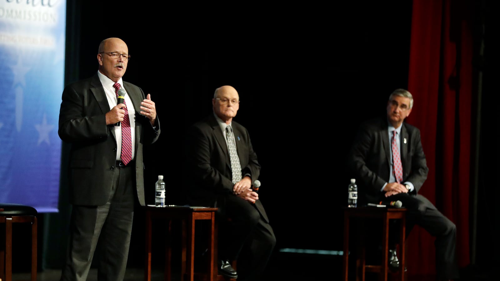 Democrat John Gregg, left,  responds to a question during a debate for Indiana Governor, Tuesday, Sept. 27, 2016, in Indianapolis. Libertarian Rex Bell and Republican Lt. Gov. Eric Holcomb also participated in the debate.