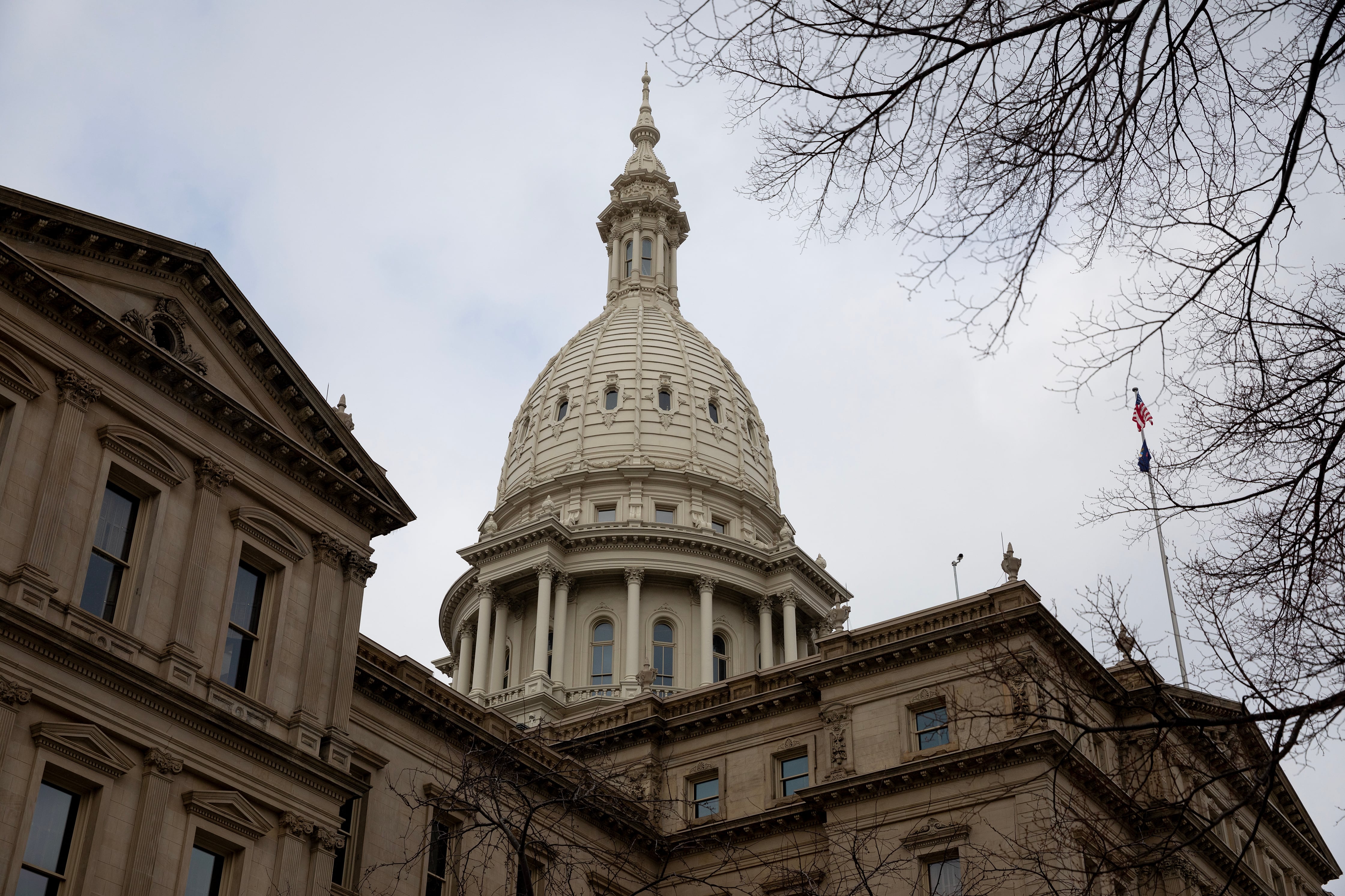 A large stone Capitol building on a cold, cloudy day.