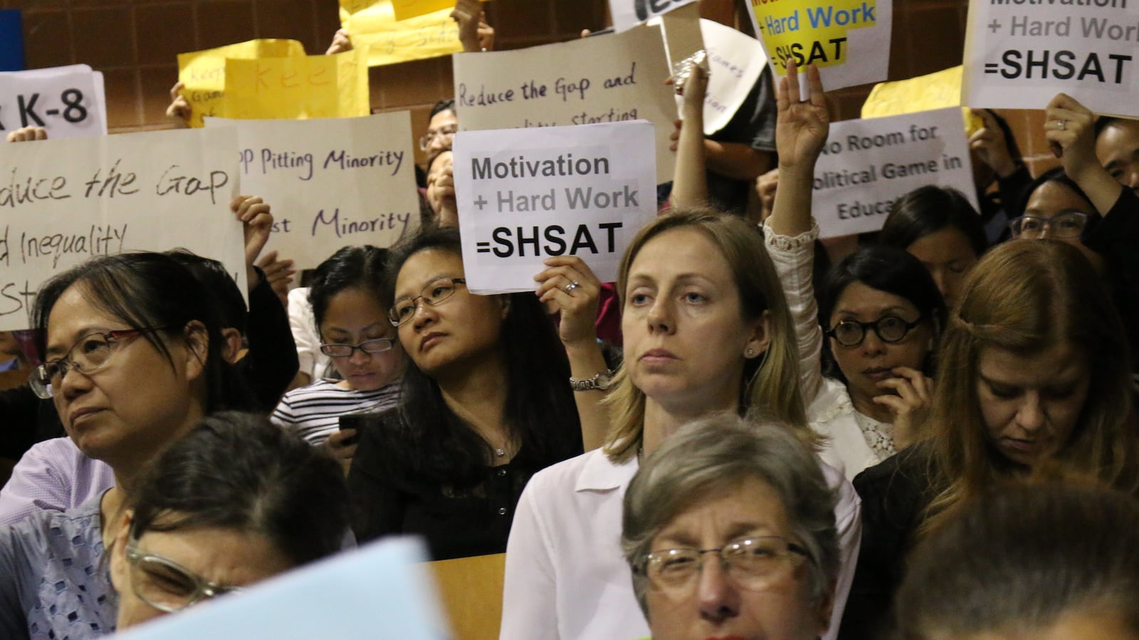 At a town hall this summer in Brooklyn's District 15, parents protested city plans to overhaul admissions to elite specialized high schools.