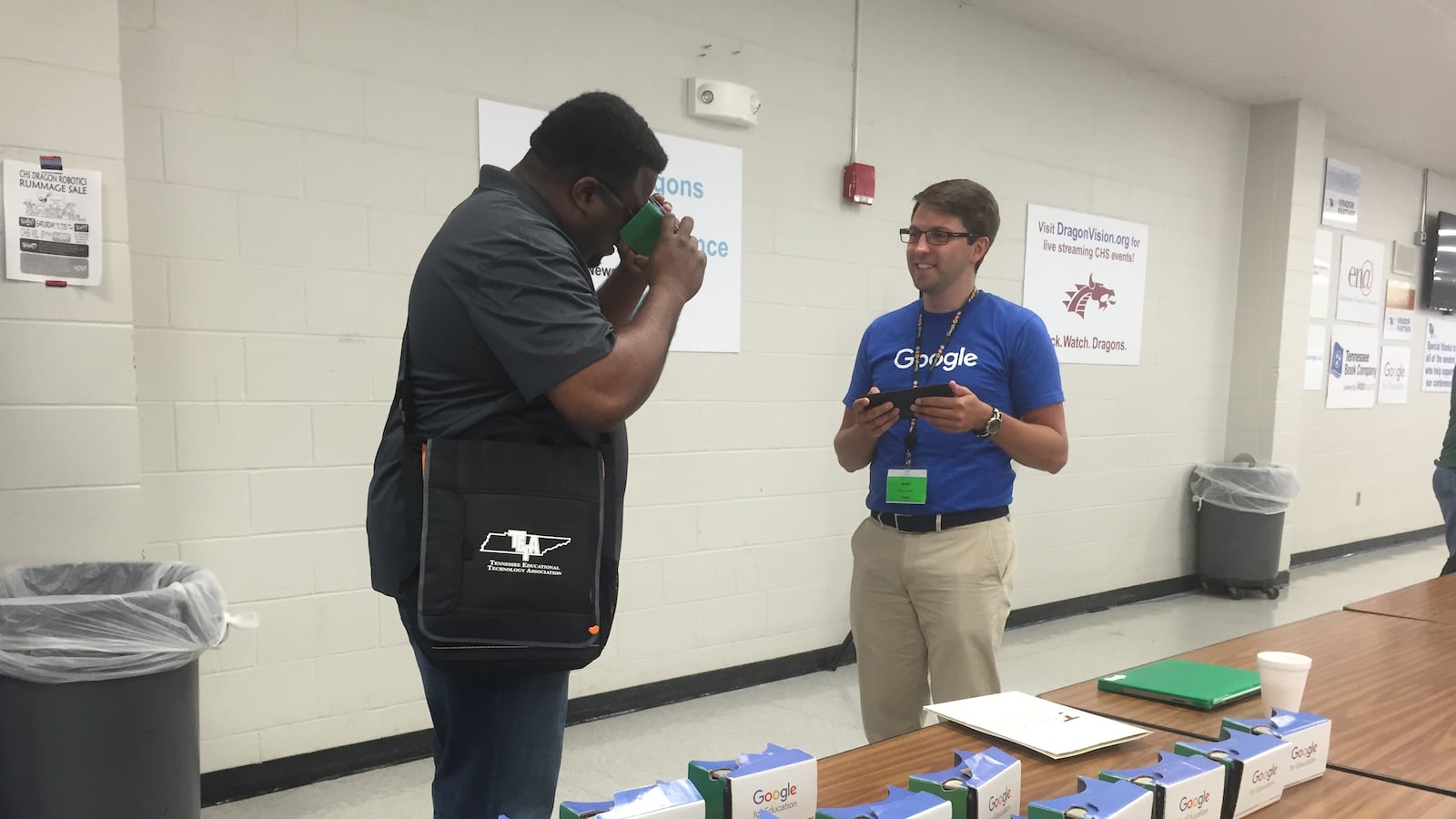 Torrence Myers, a technology specialist at Collierville High School, tries out Google Cardboard at the Tennessee Educational Technology Association's summer institute in Collierville.