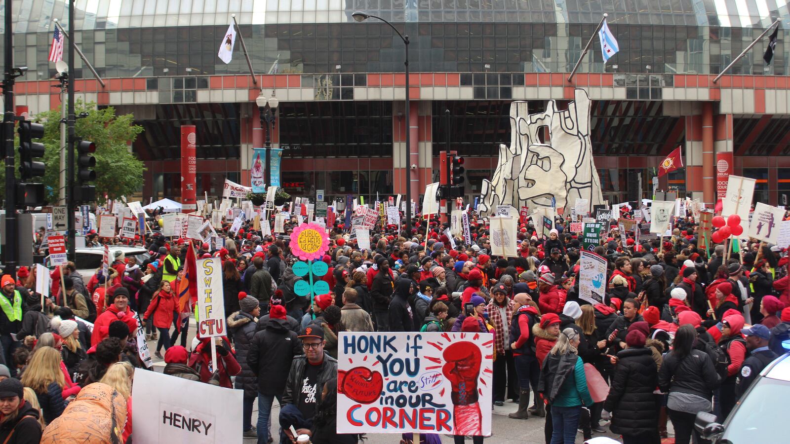 Teachers rally at the Thompson Center Wednesday during a massive gathering that union leaders said drew 30,000.