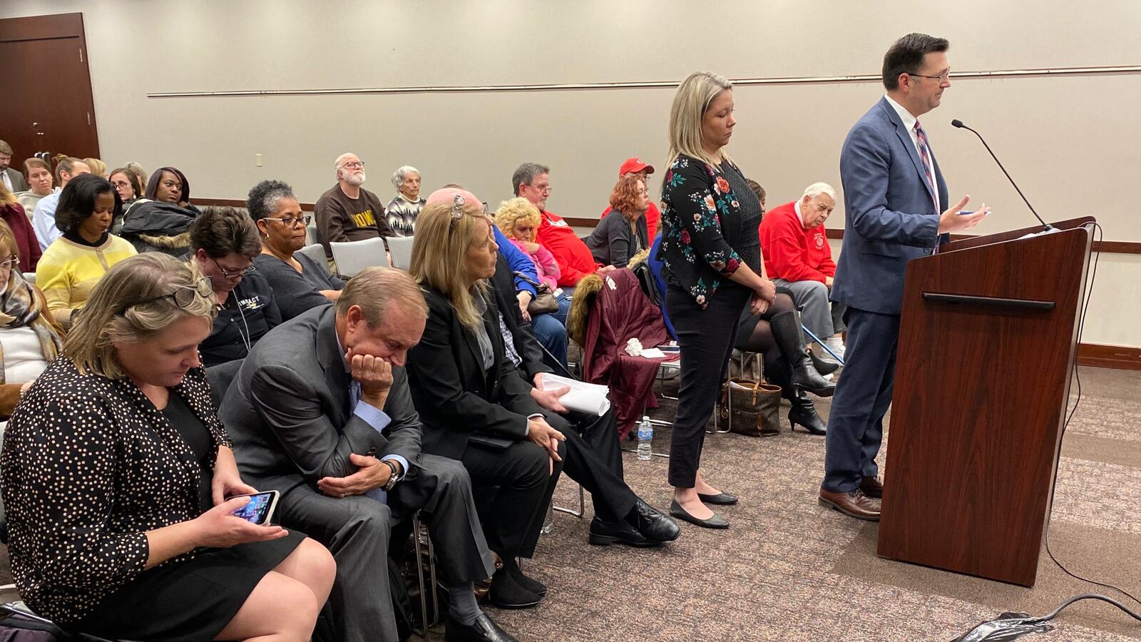Charter Schools USA CEO Jon Hage, second from left, listens to discussion about the charter application for Howe High School on Friday, Dec. 13, 2019.