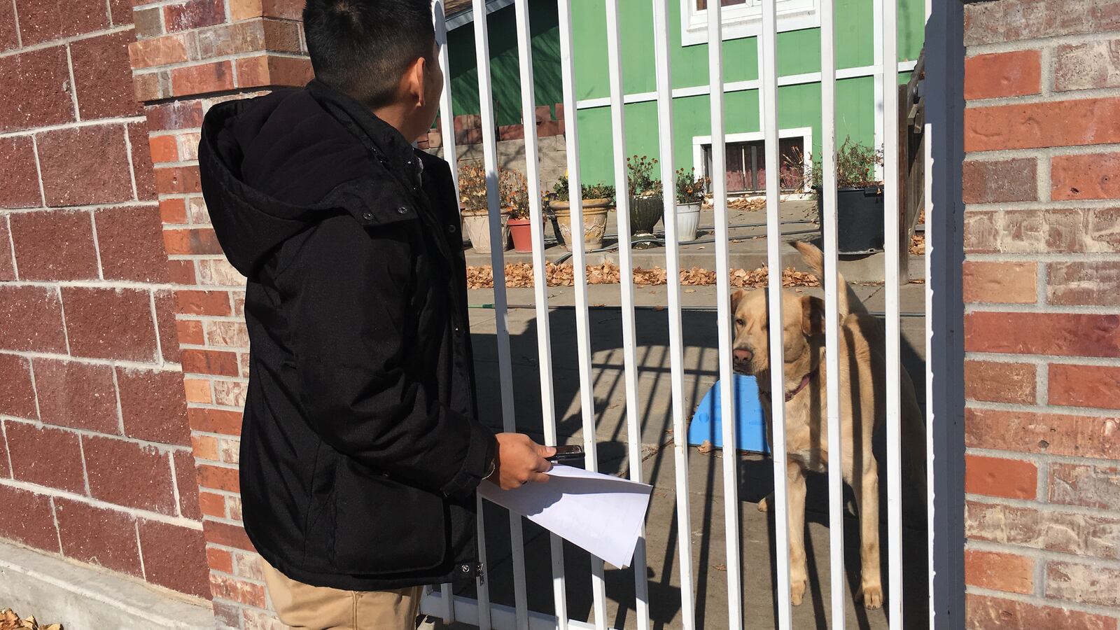 Bonifacio Sanchez Flores, a social worker at Grant Beacon Middle School, visits the home of a student who didn't come to school on Halloween.