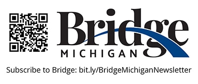 A black and blue logo with a QR code on a white background.
