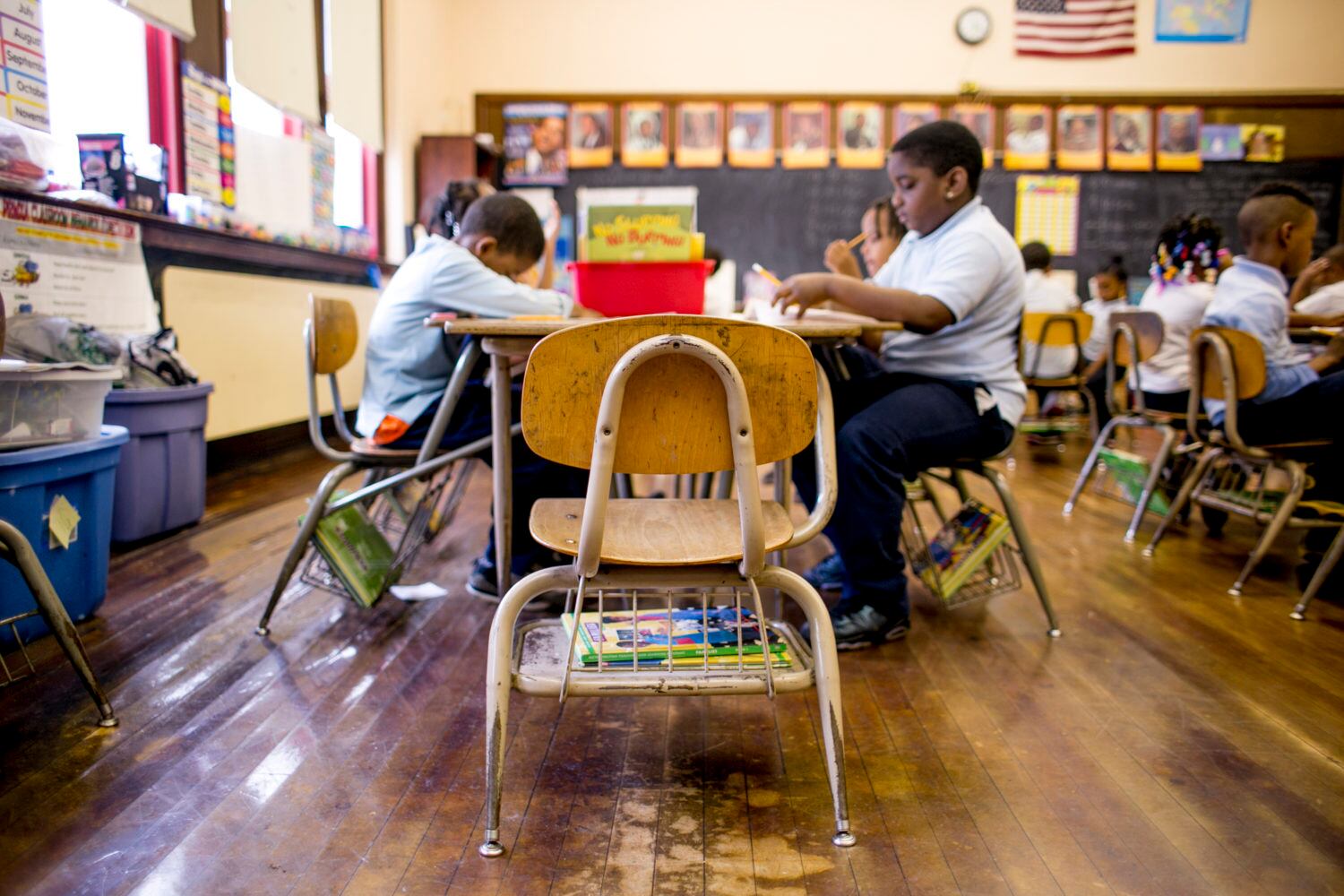 A photo of a classroom as students work at their desks.