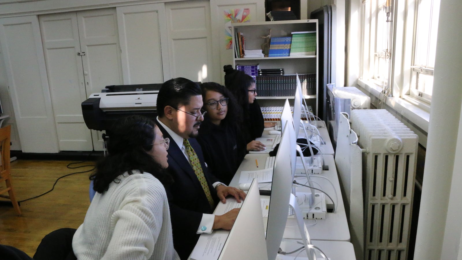 Students at Williamsburg High School of Arts and Technology teach Chancellor Richard Carranza how to code, ahead of an announcement Thursday on an expansion of CTE programs.