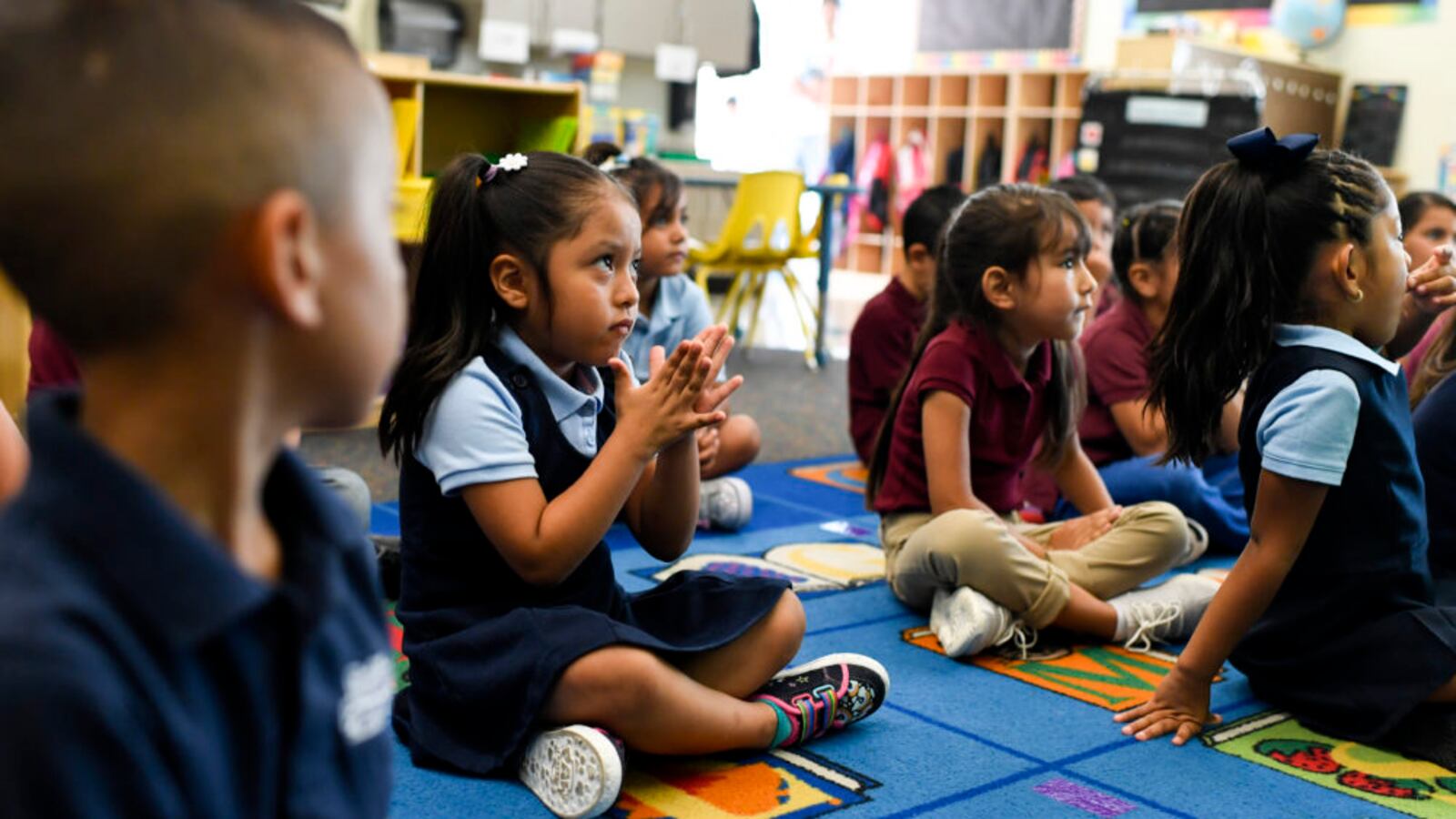 Sophia Camacena sits with classmates in kindergarten on the first day of school at McGlone Academy in Denver on Aug. 15, 2018.