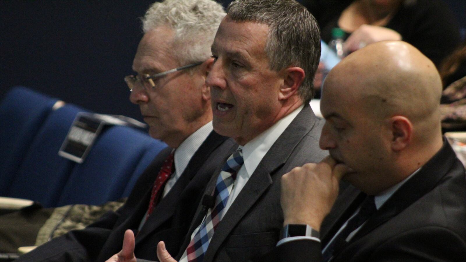 Dan Quisenberry, second from left, testifies before the Michigan Civil Rights Commission on Monday as Wayne State University finance professor Michael Addonizio and Superintendent Nikolai Vitti look on.