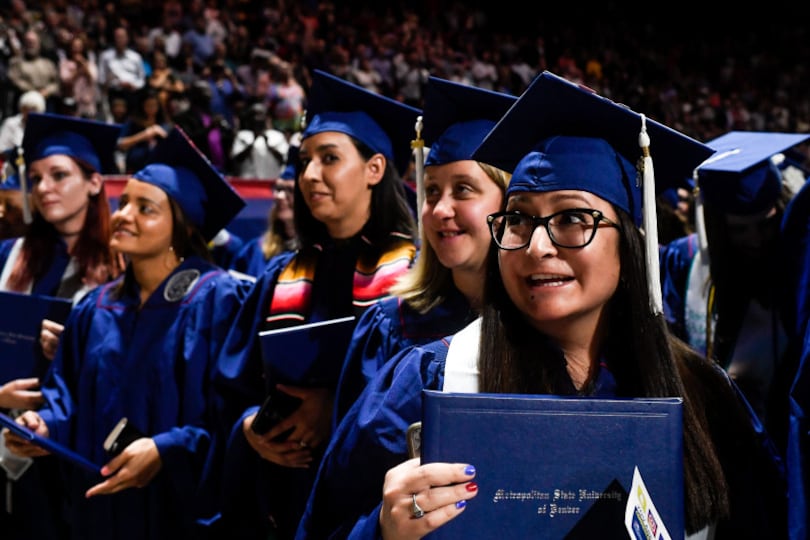Samantha Kyon (right) smiles during a graduation ceremony at Metropolitan State University of Denver in May 2018.
