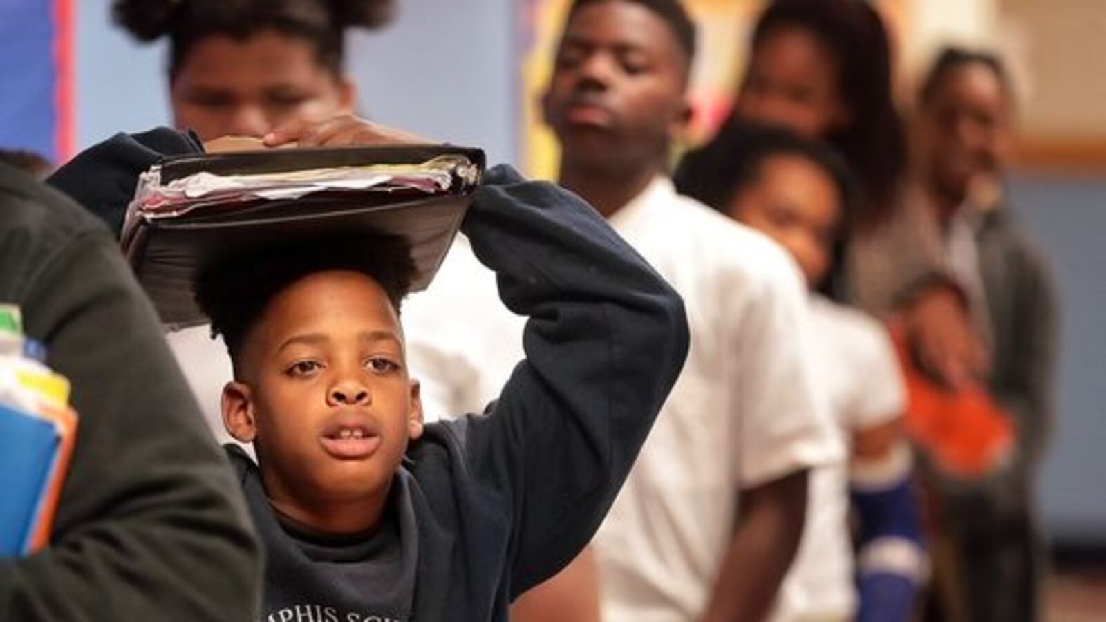 Memphis Scholars sixth graders line up to return to home room at the end of the day in April 2017. This school year, the charter organization is one of four in the state-run district with a new top leader.