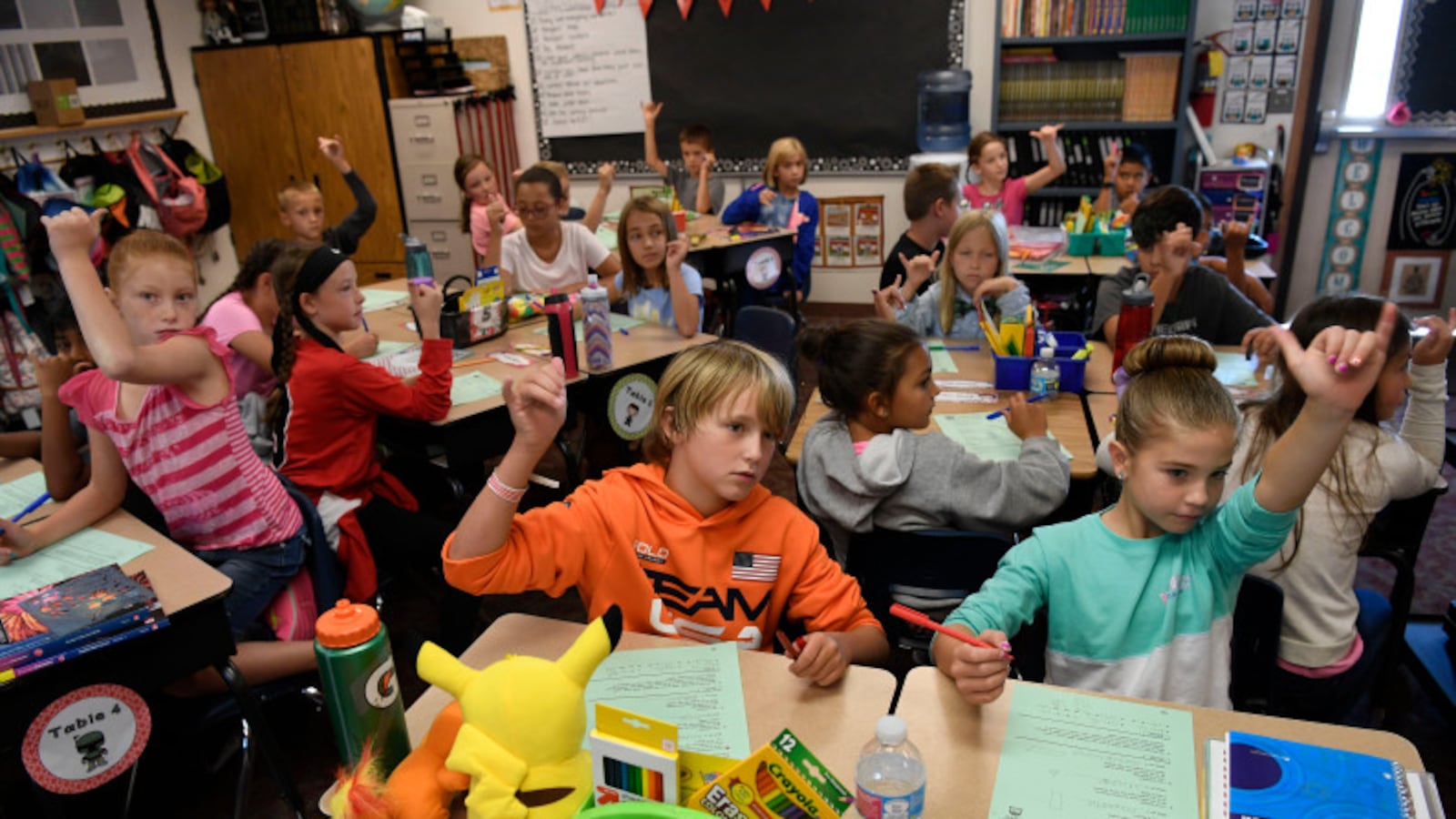 Students pack in Jennifer Hetrick's 4th grade classroom, in a temporary modular “cabin” building at Meridian Elementary in the Adams 12 district. (Photo by Andy Cross/The Denver Post)