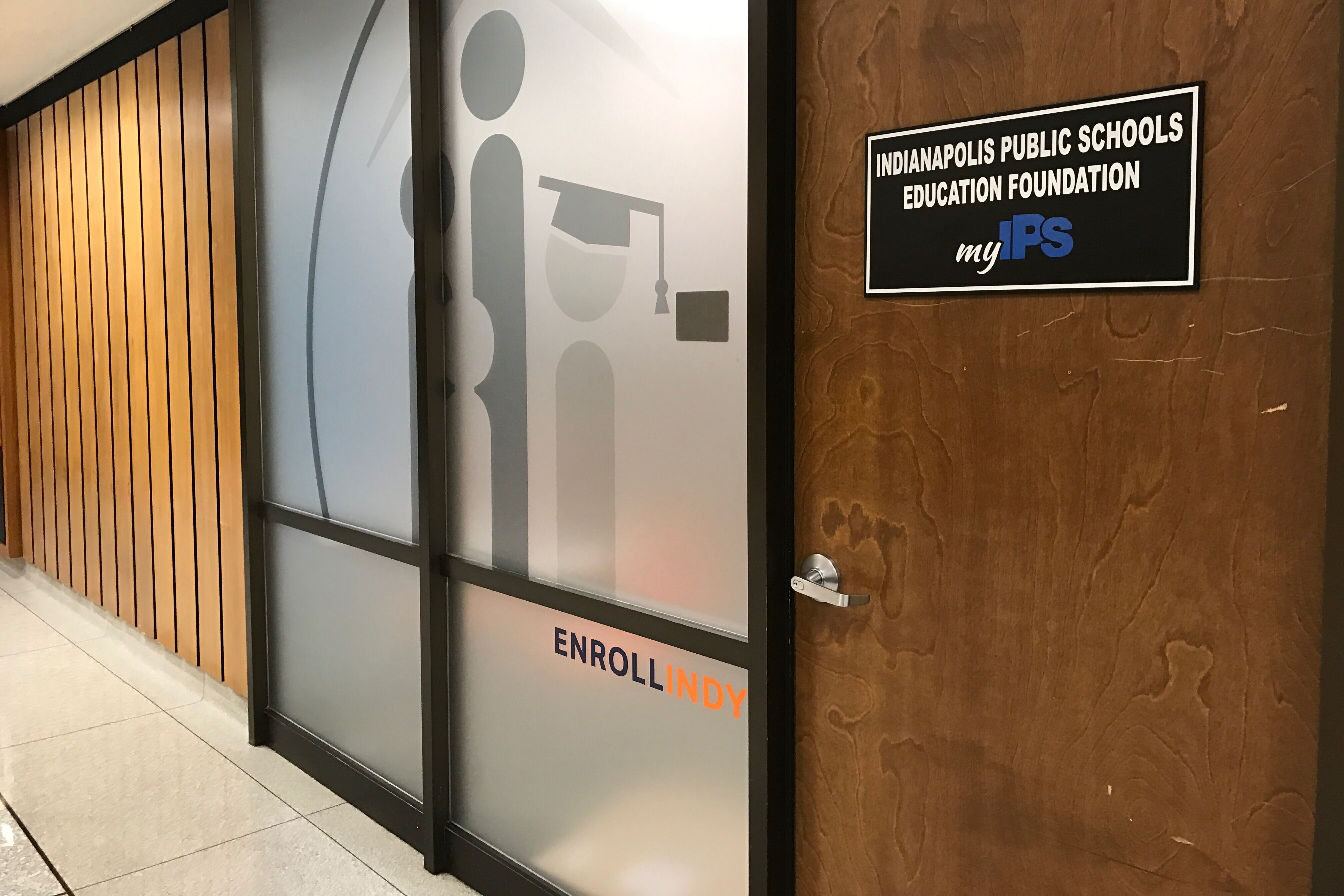 The door to the Enroll Indy office in Indianapolis Public Schools headquarters.