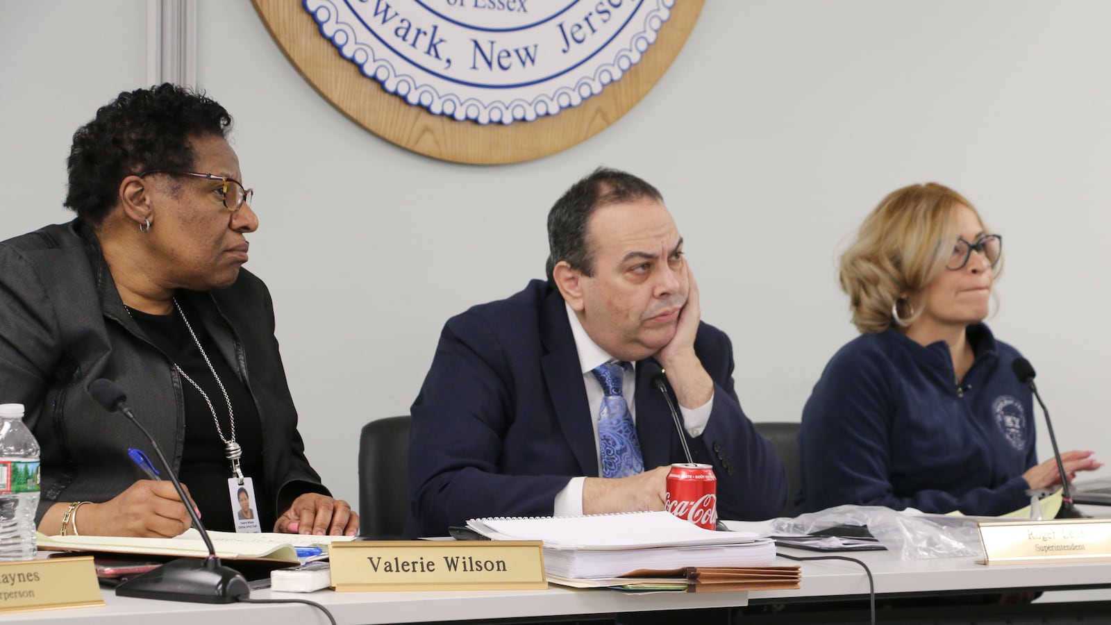Superintendent Roger León   and school board chair Josephine Garcia (right) at a board meeting. The district has not told parents what caused a delay that has kept them waiting to learn where their children will go to school this fall.
