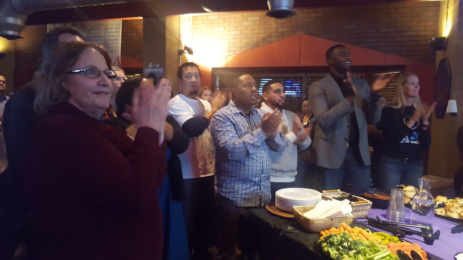 Debbie Gerkin, right, and others celebrating early returns for Aurora's school board race Tuesday. (Photo by Yesenia Robles, Chalkbeat)