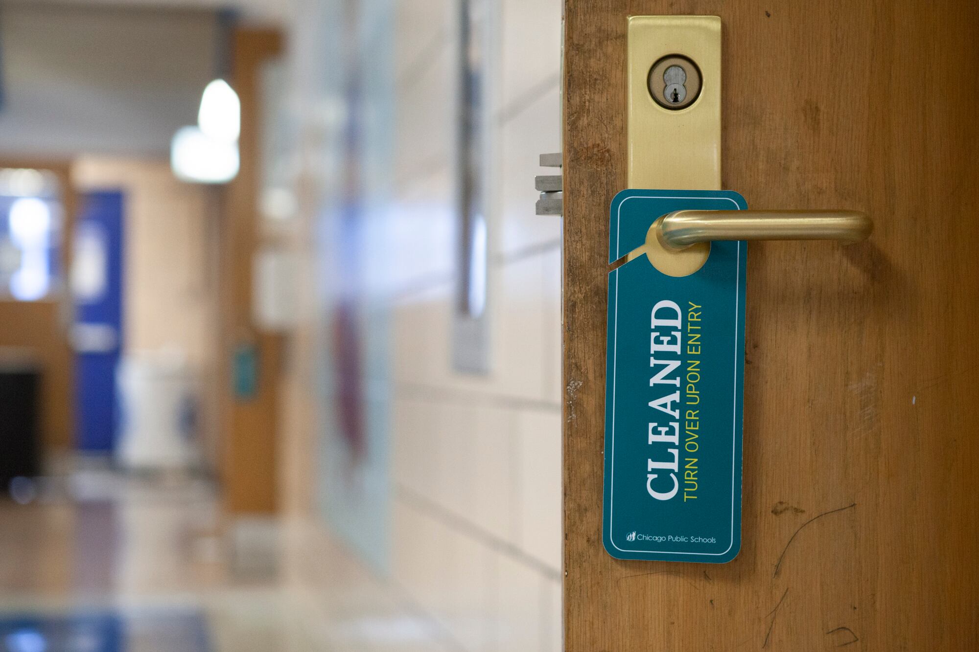 A sign hanging on a doorknob that indicates that the room has recently been cleaned.