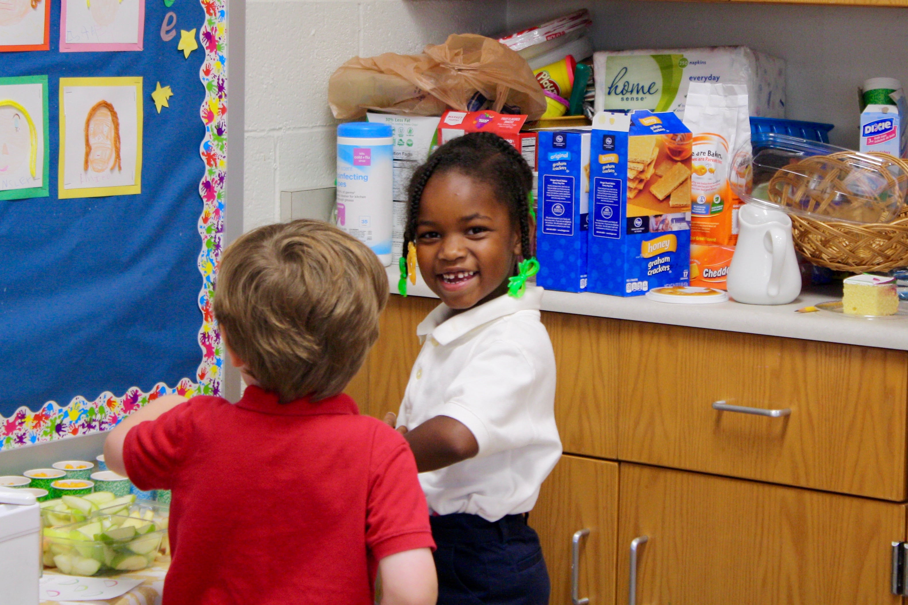 Two young students in a classroom.