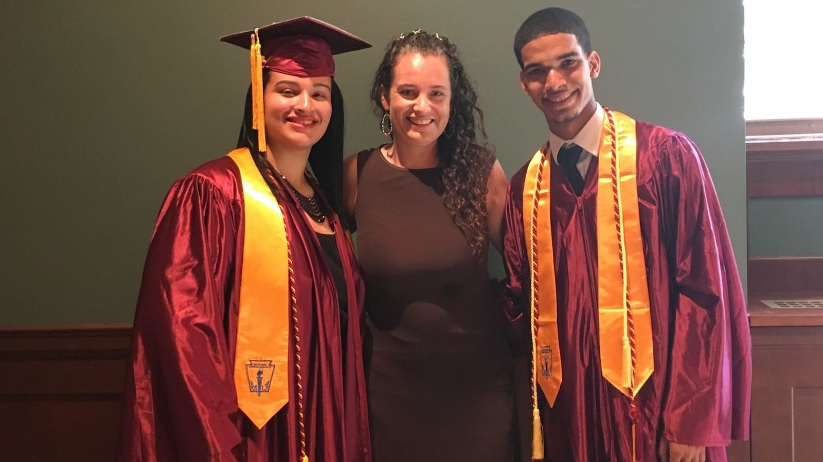 Sharon Collins at a New Heights Academy Charter School graduation with students.