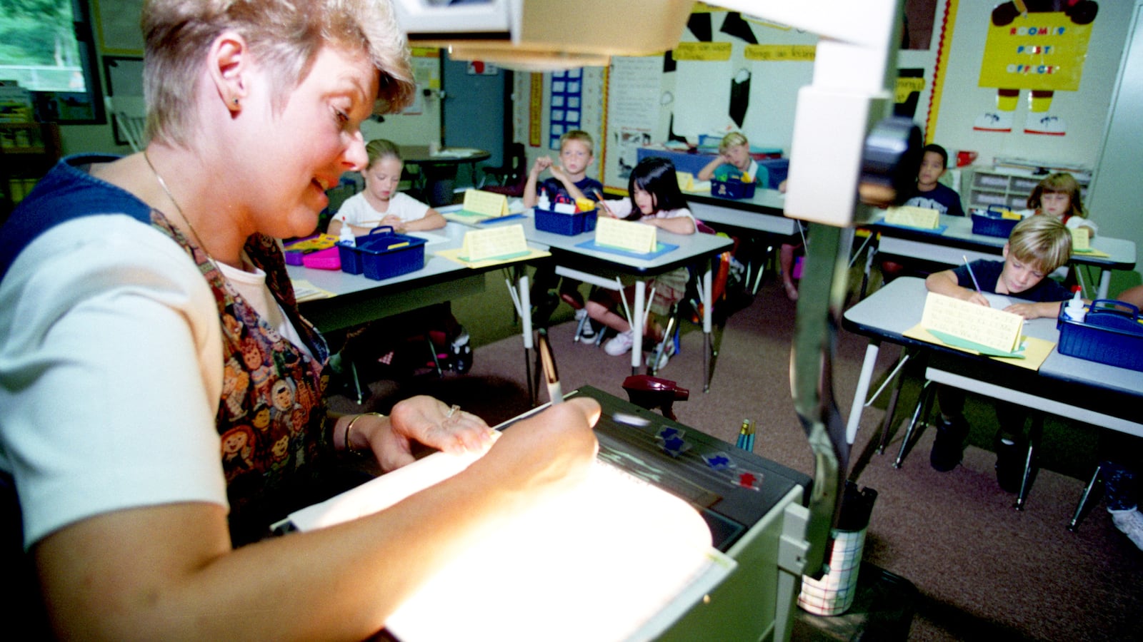 At Foxborough Elementary School, in 1996, 1st grade teacher Linda Kiefer uses a projector to show her students the formation of numbers. The Capistrano Unified School District was one of the first in Orange County, California to implement a class-size reduction plan after a state funding bill was signed.