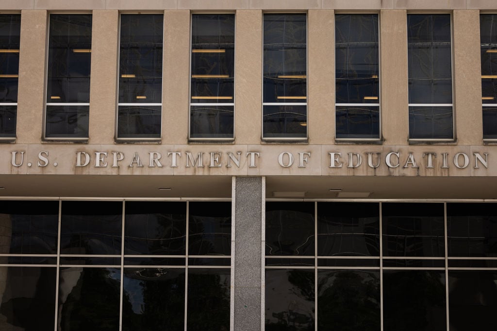 The US Department of Education building is seen on August 21, 2024 in Washington, DC. The building is a large, gray, brutalist building.