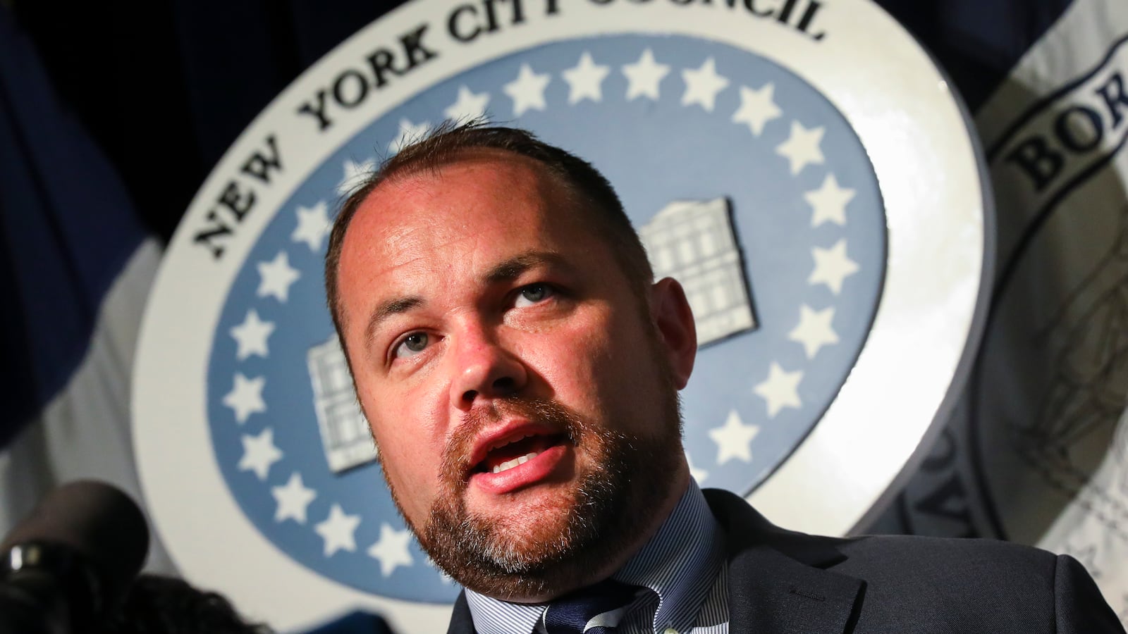 New York City Council Speaker Corey Johnson speaks during a rally last July.