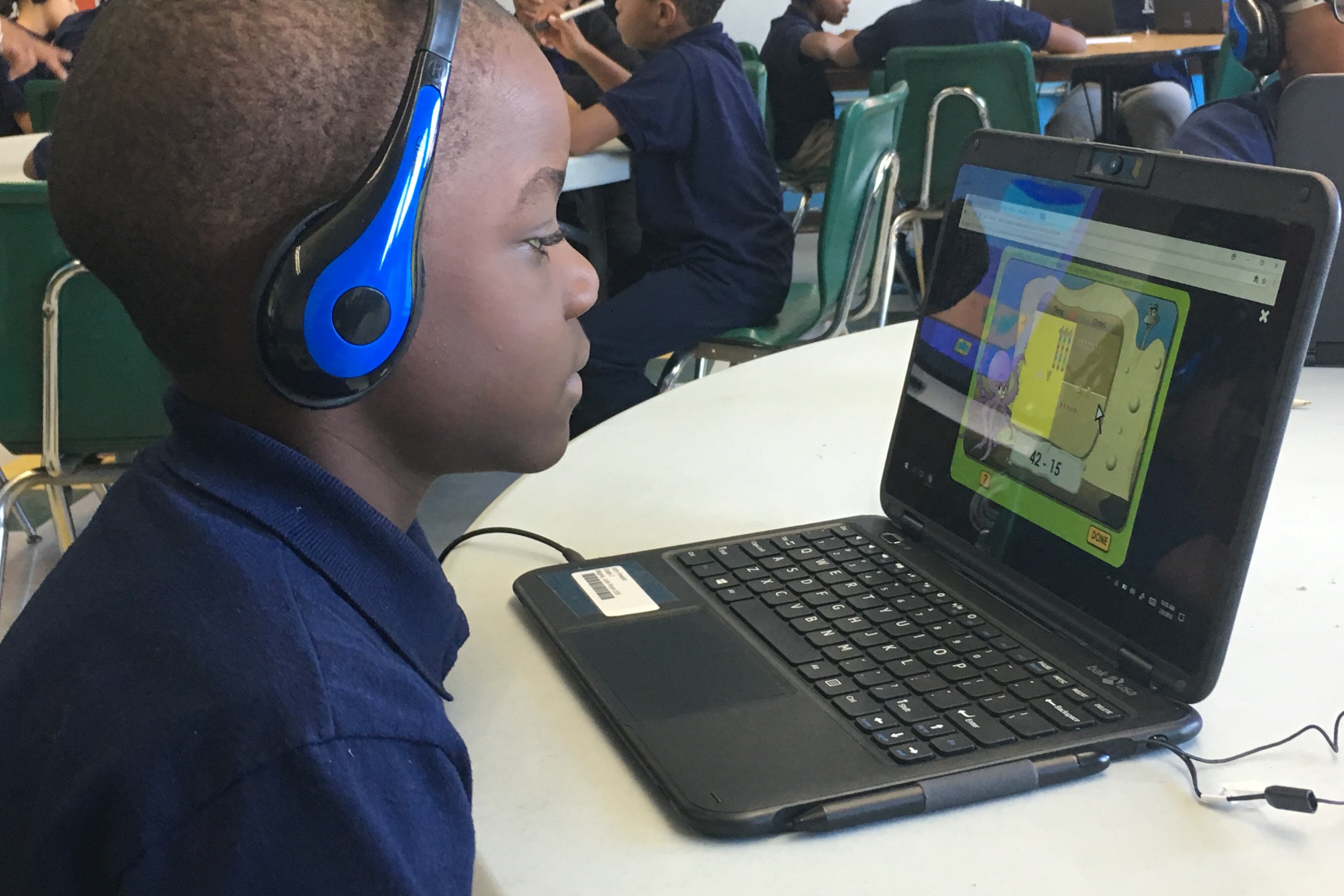 A student at Cooke STEM Academy uses a new personal computer for individual learning.
