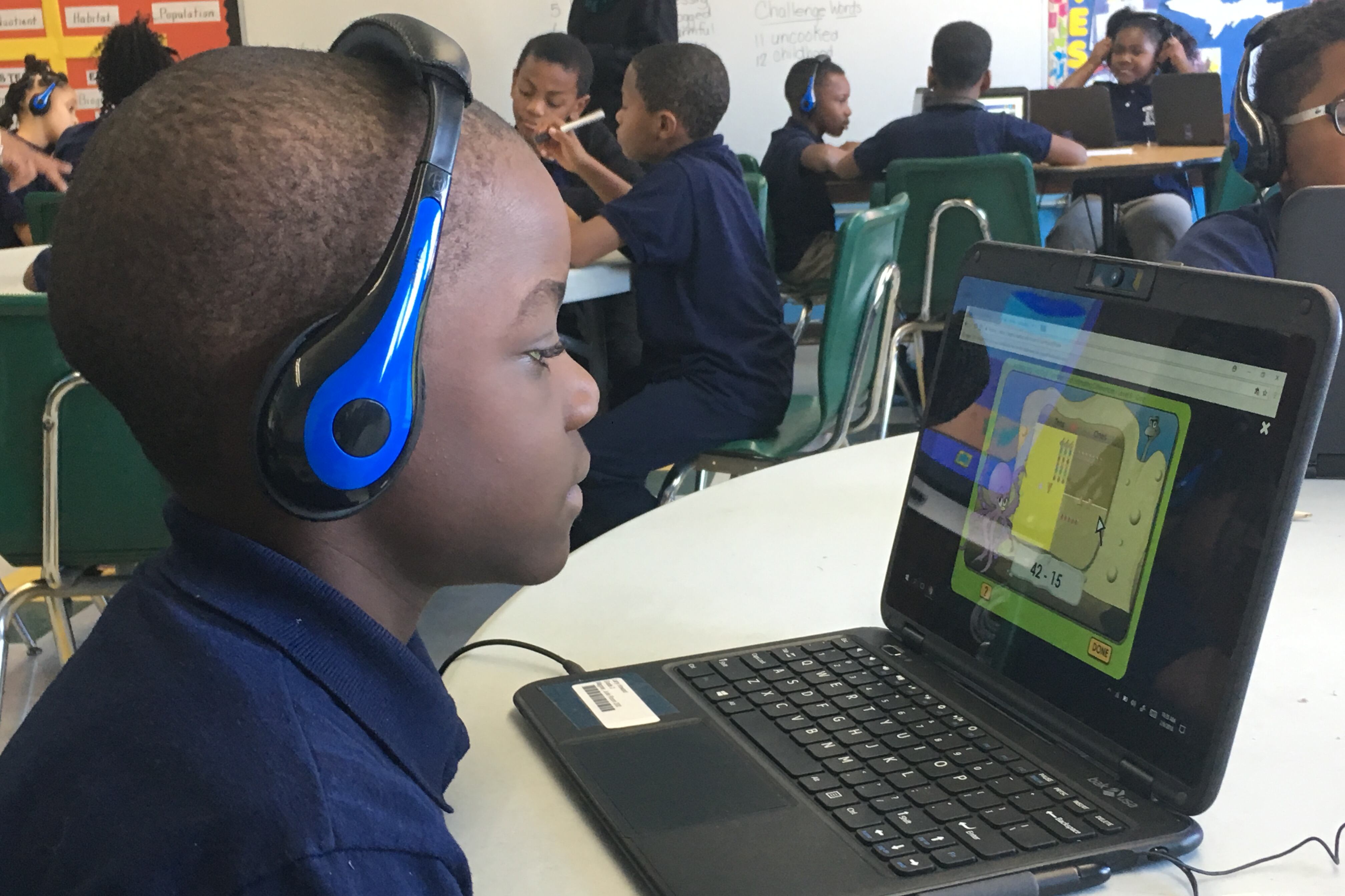 A student at Cooke STEM Academy uses a new personal computer for individual learning.