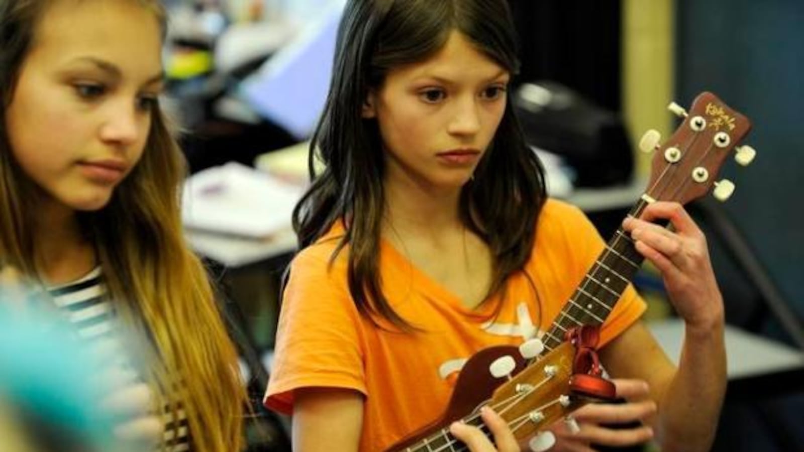 Students practicing ukulele during band practice at Montessori Peaks Academy  in 2015 in Jeffco. (Photo by Denver Post)