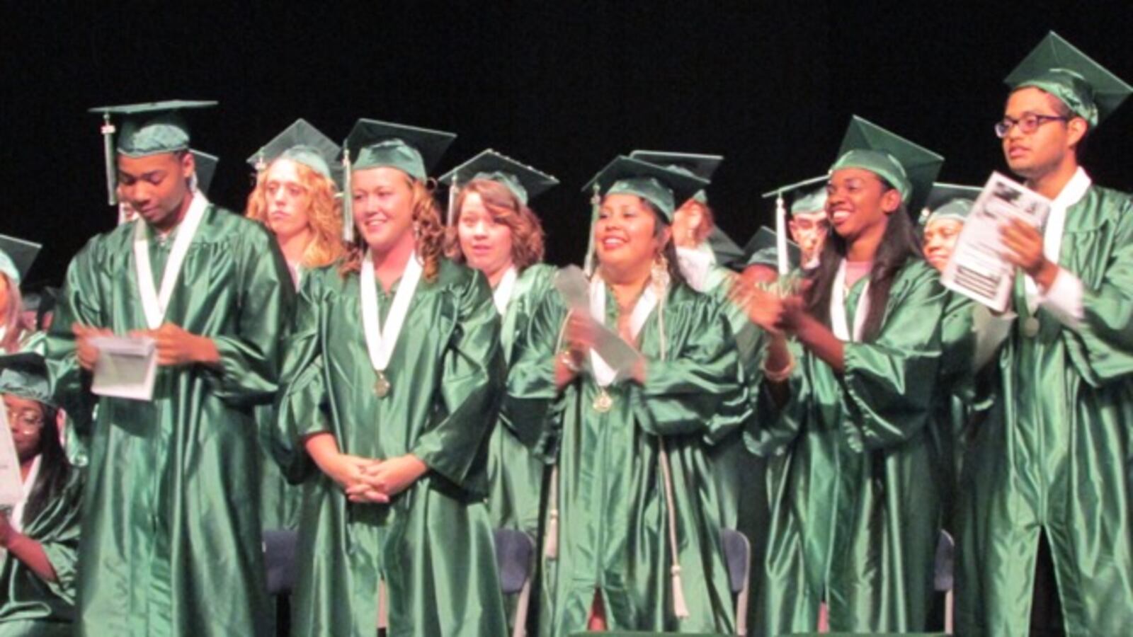Excel Center graduates cheer their classmates.