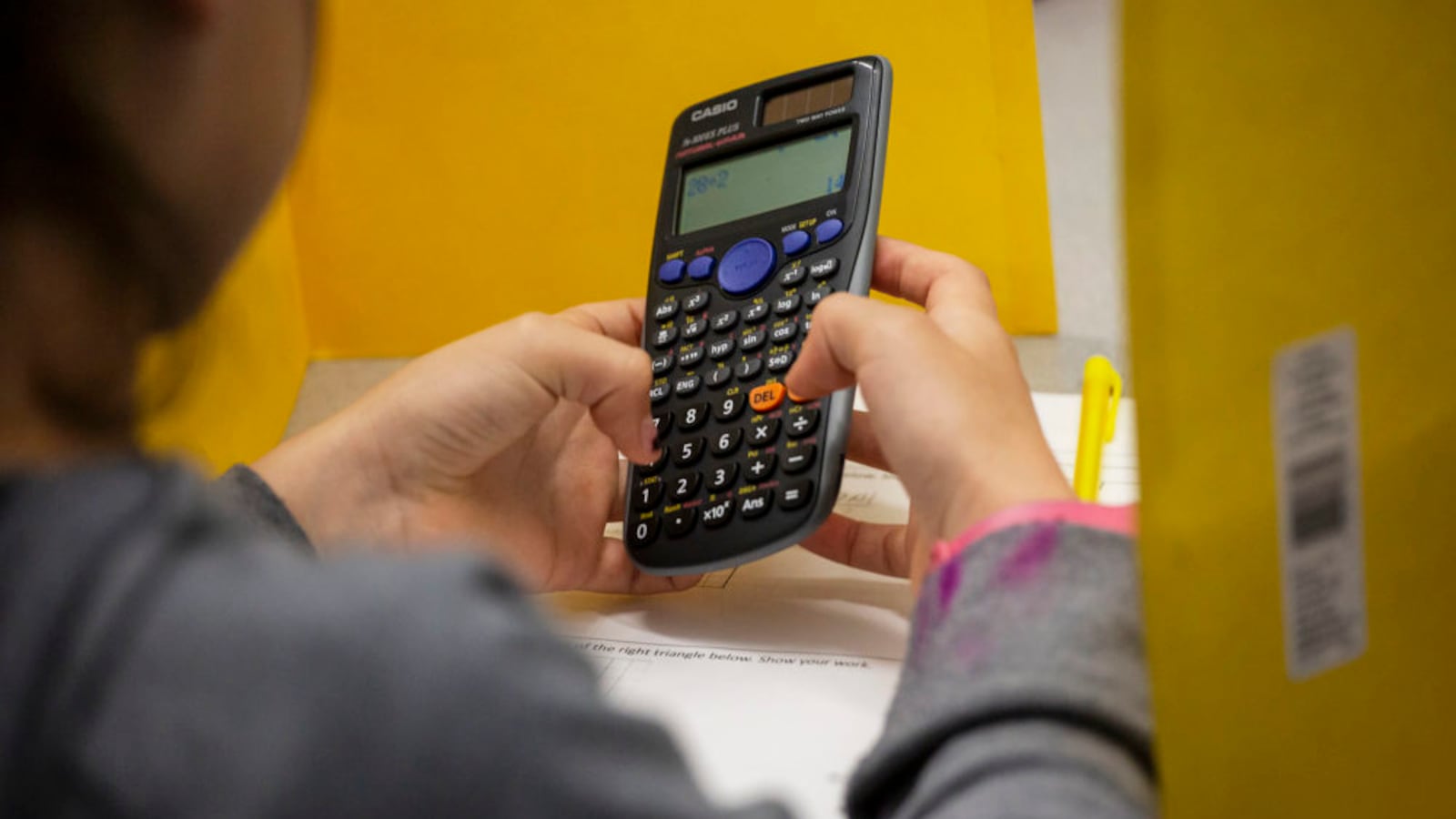 A Noel Community Arts School student works on a calculator during a tutoring period in May 2019.