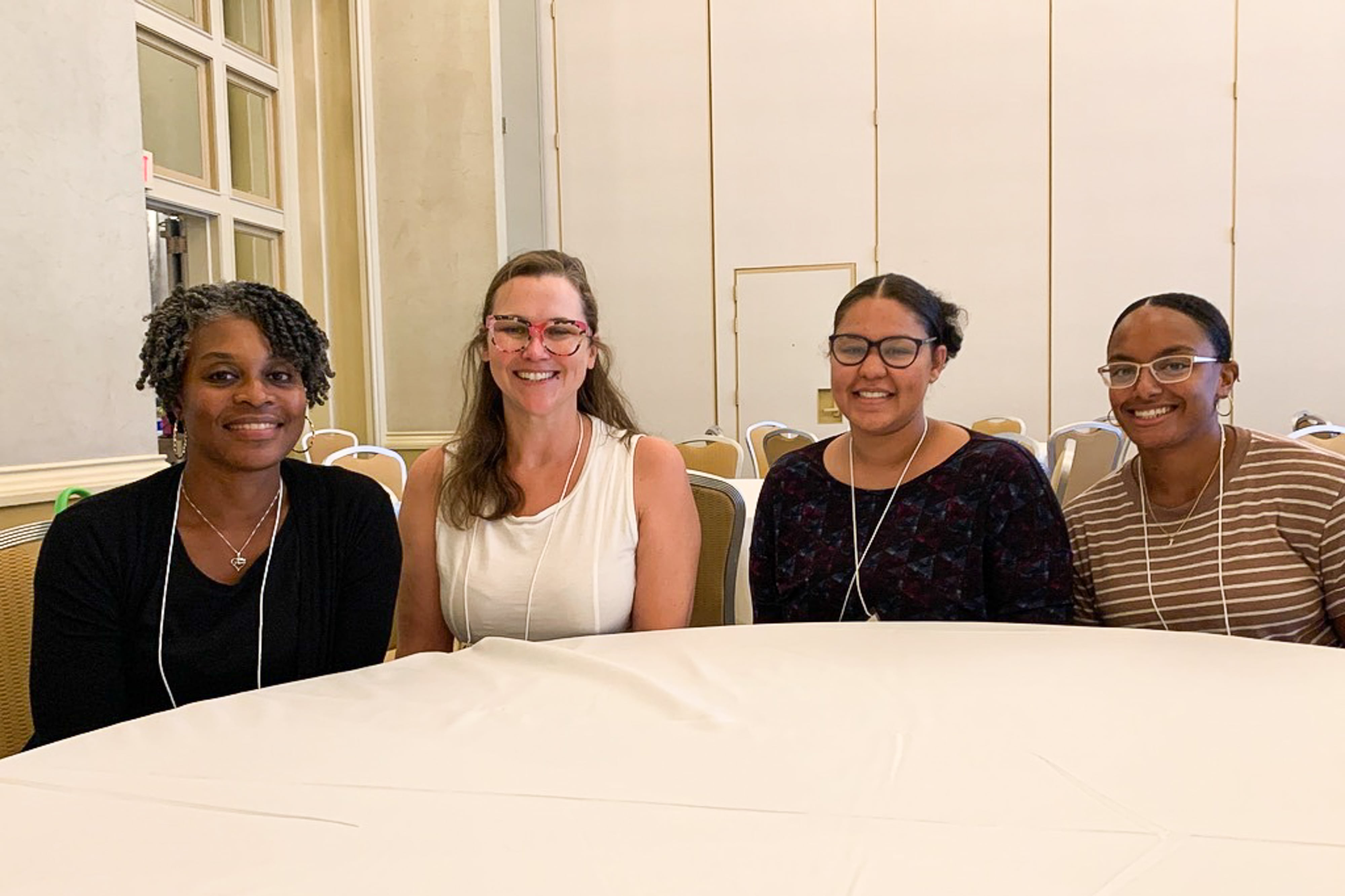 Four teachers sitting at a table