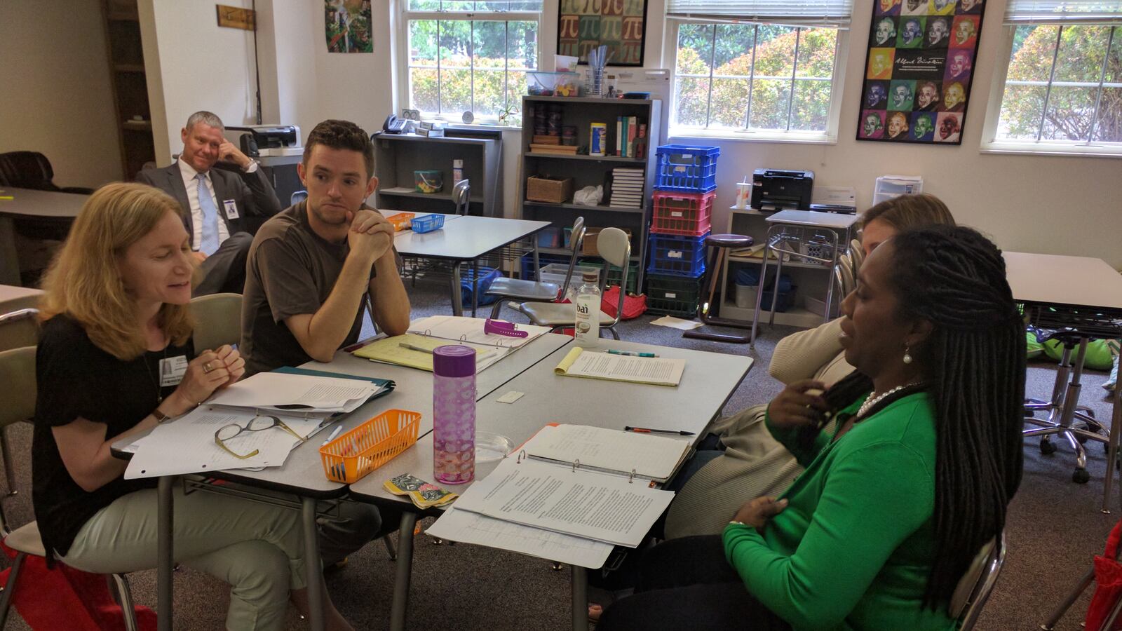 From left: Teachers Jennifer Weinblatt of Harding Academy, Tom Cirillo of Montgomery Bell Academy, Katie Reen of University School of Nashville, and Tiffani Norman of Cane Ridge Elementary School discuss teaching strategies during the inaugural Educators' Cooperative training in Nashville, as Nashville charter school officer Dennis Queen looks on.