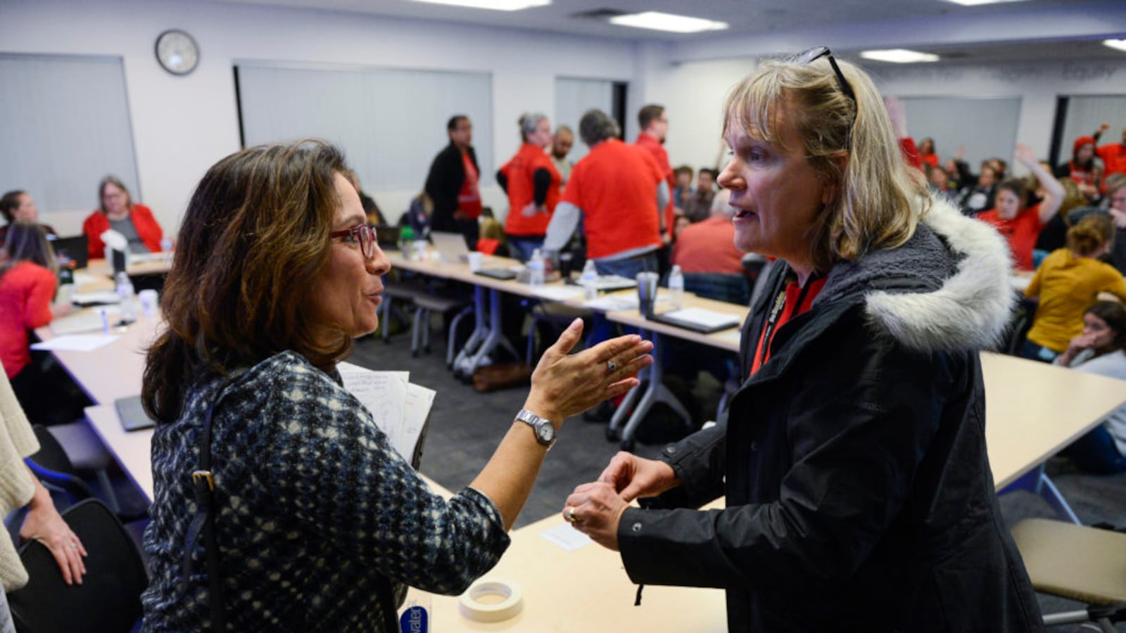Denver Superintendent Susana Cordova, left, talks with Denver Green School English language acquisition teacher Paula Zendle during a break in negotiations between the district and the union.